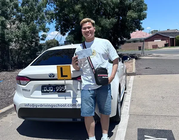 Adult learner driver celebrating training success in Shepparton