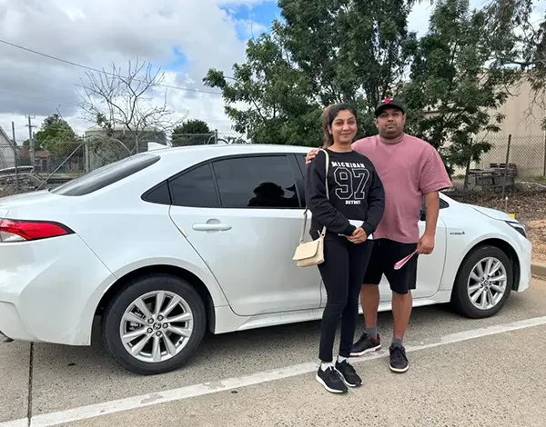 Automatic Driving Lessons 23 VicRoads test success beside a dual-control driving school car
